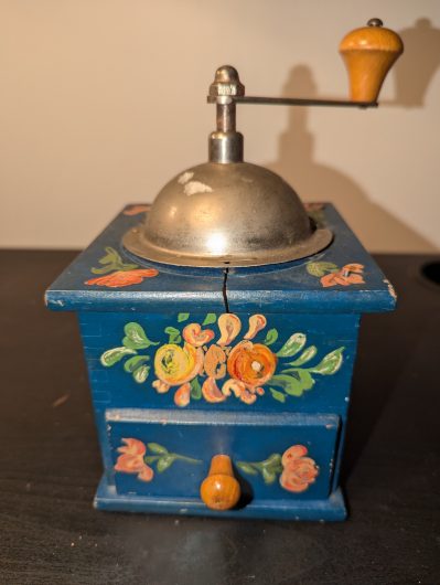 Vintage-style hand painted manual coffee grinder