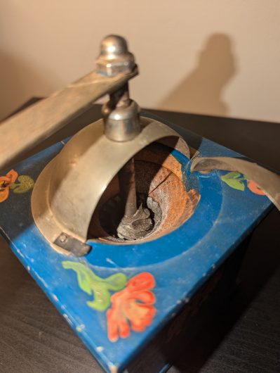 Vintage-style hand painted manual coffee grinder