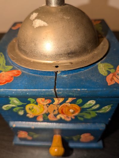 Vintage-style hand painted manual coffee grinder